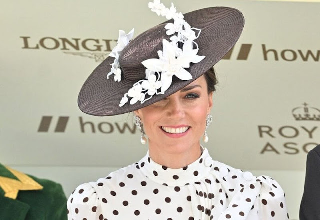 Kate Middleton wore a new asymmetric polka-dot silk crepe dress by Alessandra Rich. Pearls diamond earrings