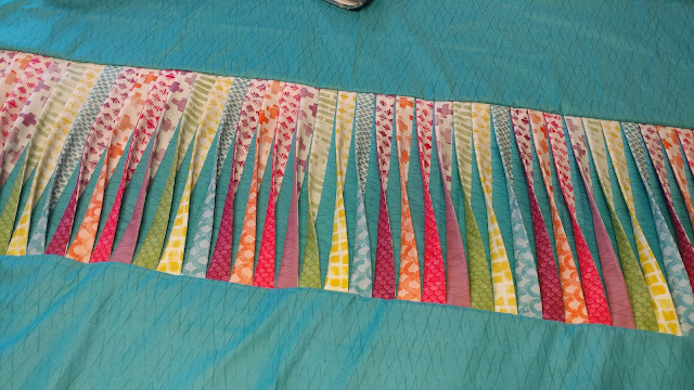 Texture quilt with 3-D twisted strips