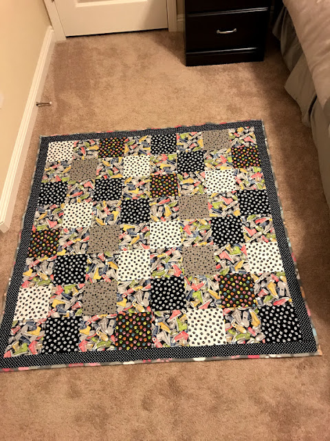 full view of the paw prints and tennis shoes quilt