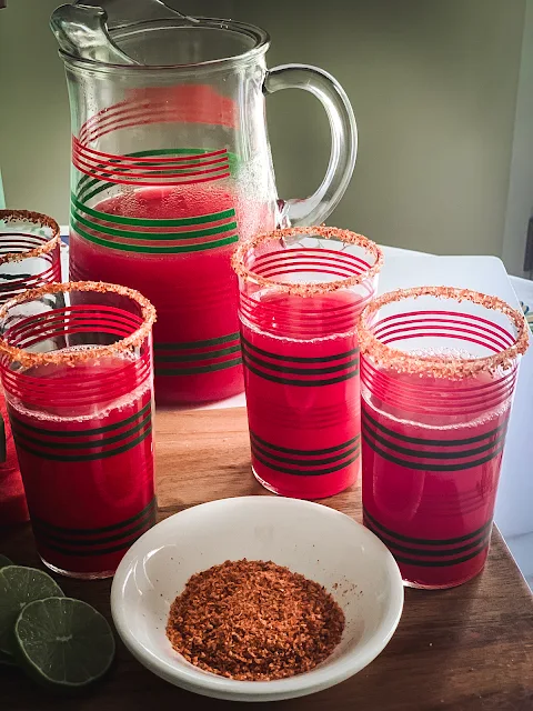 Fabulous fresh Watermelon Juice, naturally sweet, refreshing chunks of watermelon that yield a superb juice, perfect on a hot summer day.    The ingredients are simple, only one, watermelon with a rub of a cut side of lime on the rim of the glass and dipped in the spicy Tajin, tasty.