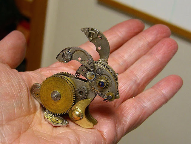 Intricate steampunk sculpture of recycled old parts watch
