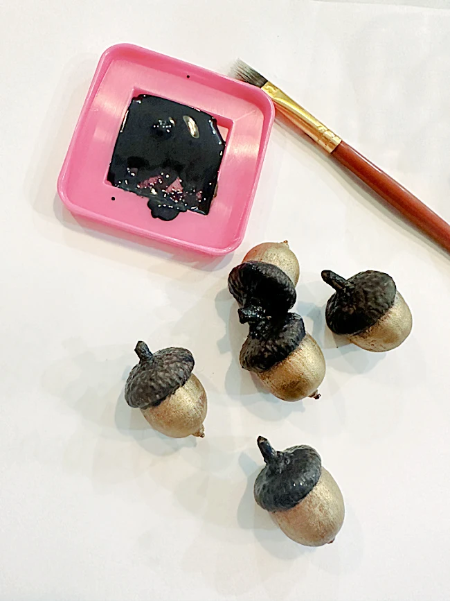 painting gold and black acorns