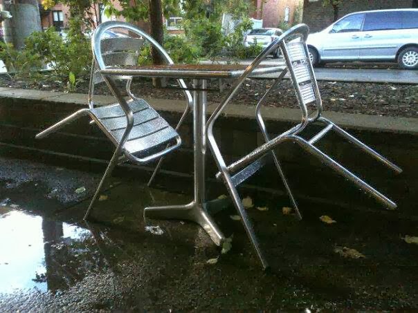 coffee shop, patio furniture, chairs, table, parked cars