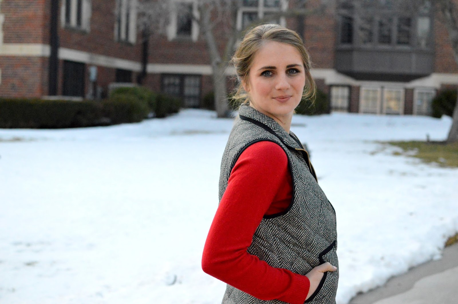 red top with a herringbone vest