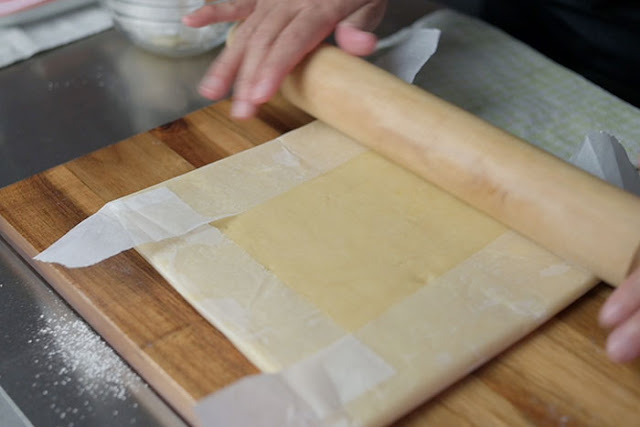 use rolling pin to even out the surface