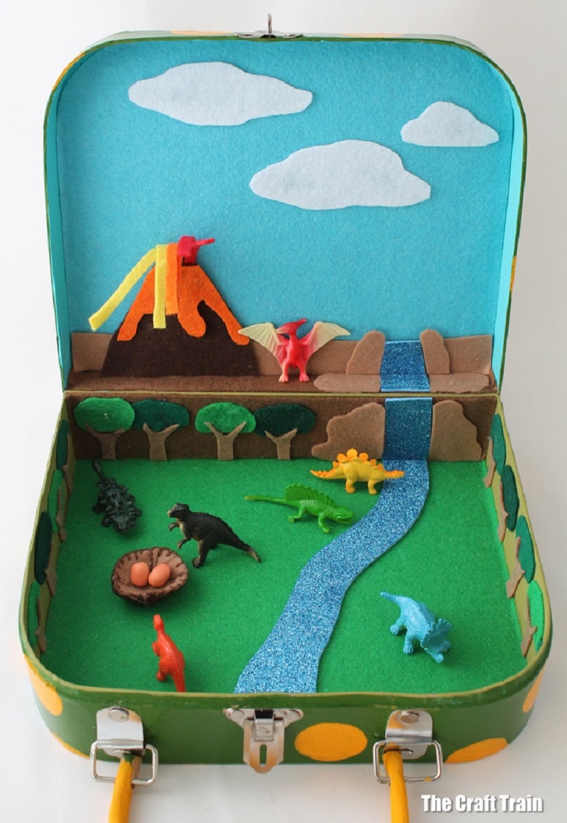 dinosaur travel small world in a suitcase