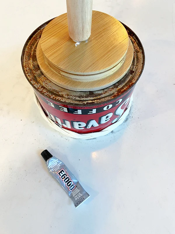 wooden stick on top of can