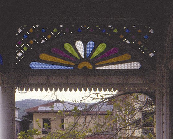 Detail of colored glass window arch in Carcar City Museum
