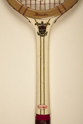 A Demon Slazenger racket, wooden and with white, gold and red detailing