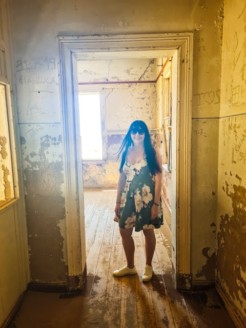 Girl in abandoned house in Namibian mining ghost town
