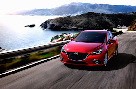 Front 3/4 view of the 2015 Mazda 3