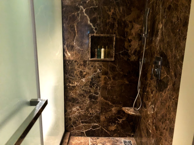 Marble shower stall with rain shower head