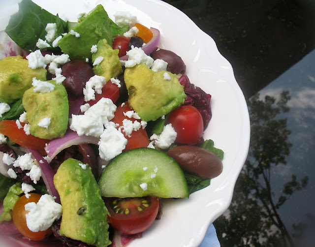 greek salad alongside avocado