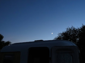 tiny trailer against night sky