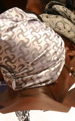 Nkontim swastika on a woman's headscarf in Ghana.