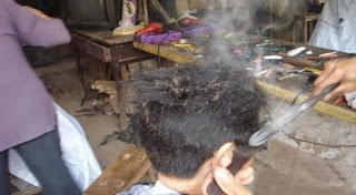 Metode Cukur Rambut Dengan Logam Panas Yang Unik