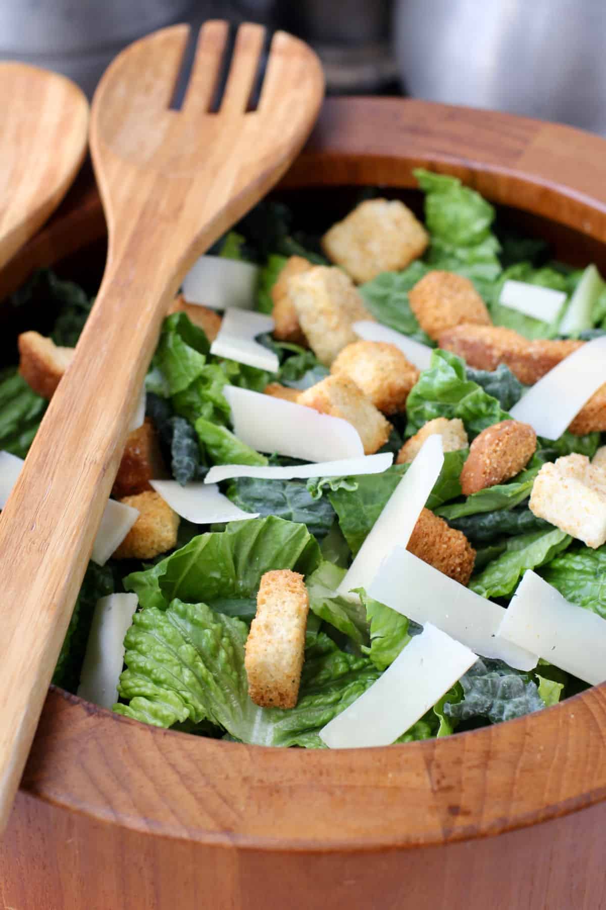 Kale Caesar Salad in a wooden bowl.