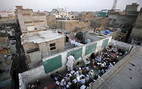 Students attend a rooftop evening class