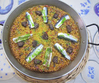 Arroz con butifarra negra y sardinas