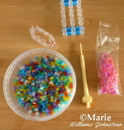 Stretchy rubber bands, loom boards, colorful beads and hook