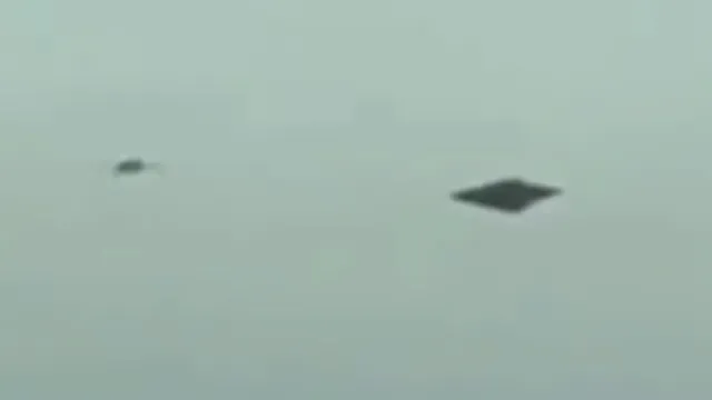 Smaller UFO next to it's Mothership craft over Los Angeles CA USA.