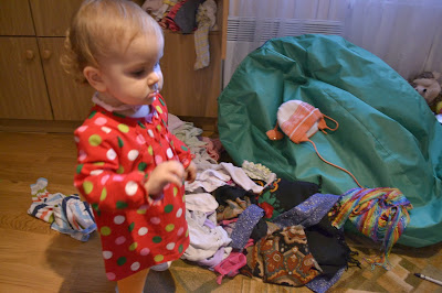 small girl in child's room, mess around