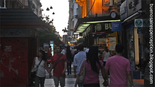 People Strolling along the most Famous Pedestrian Zone in Buenos Aires: The Shopping Street 