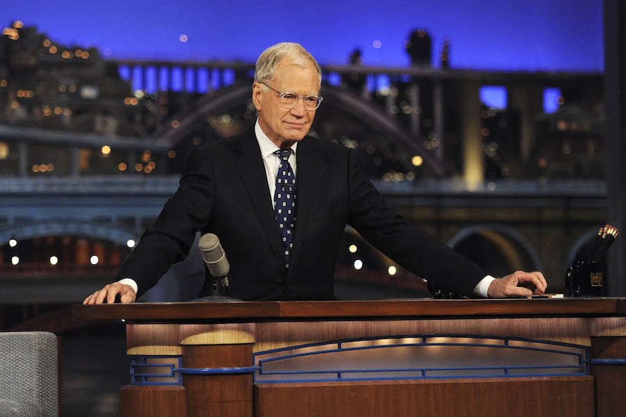David Letterman seated at desk on Late Show