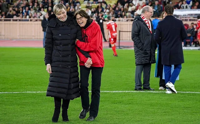 Princess Charlene wore a new black down-filled detachable-hood puffer coat by Burberry, Camille Gottlieb wore a sky blue coat