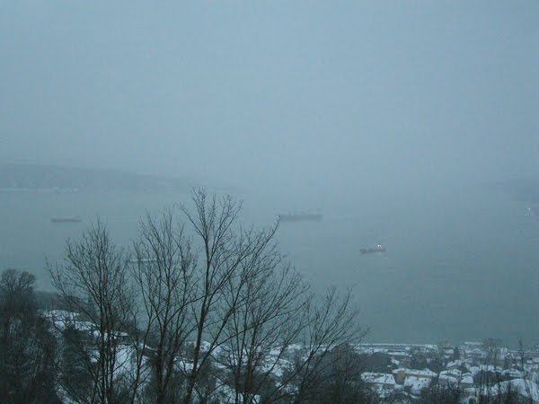 Boats on the Bosphorus in a snowstorm.