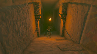 Link with a torch descending into the pyramid