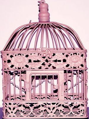 Pink birdcages as centerpieces with brown linens wedding spray painted 