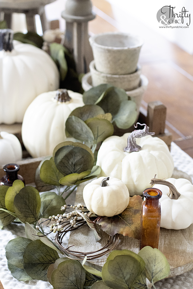 neutral fall tablescape decor, Fall dining room decor, fall table setting. Neutral fall centerpiece. Farmhouse fall dining room. Amber vase, amber bottles