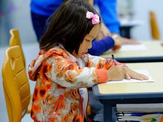 Image: Toddler Coloring at Desk | Photo by Jerry Wang on Unsplash