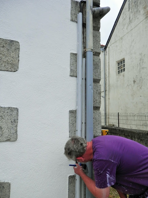 painting the exterior of an old french house