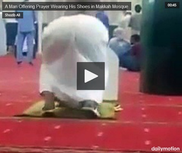  A Man Offering Prayer While Wearing His Shoes in Makkah Mosque