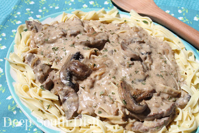 Seasoned cube or sirloin steaks, with onions and mushrooms, in a cream sauce with sour cream on a bed of buttered egg noodles.