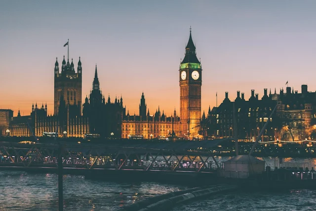 Stock photo of the Palace of Westminster at night across the River Thames