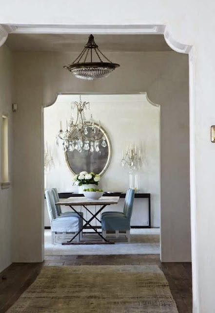 traditionally decorated white foyer and dining area