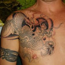 Don't get Japanese Dragon Tattoos until you read this. After reading this short article, you will be more well informed and able to make a better choice when selecting your Design.  Let's begin. The dragon has long been an important symbol in Japanese mythology. The Japanese dragon is a fascinating creature with the head of a camel, eyes of a hare, horns of a deer, scales of a carp, paws of a tiger, and claws of an eagle. Additionally, Japanese dragons also commonly have long whiskers and a jewel under its chin.  Many people are attracted to the allure of these mystical creatures, but few people truly know what they symbolize. Japanese dragons, like their Chinese counterparts, are distinct from Western dragons. Whereas in Western culture they are depicted as evil and malevolent, dragons in Japanese Mythology are viewed as guardians of the imperial families. For this reason, many people chose the Japanese dragon to serve as a guardian and protector. In Japan, a dragon is normally called 