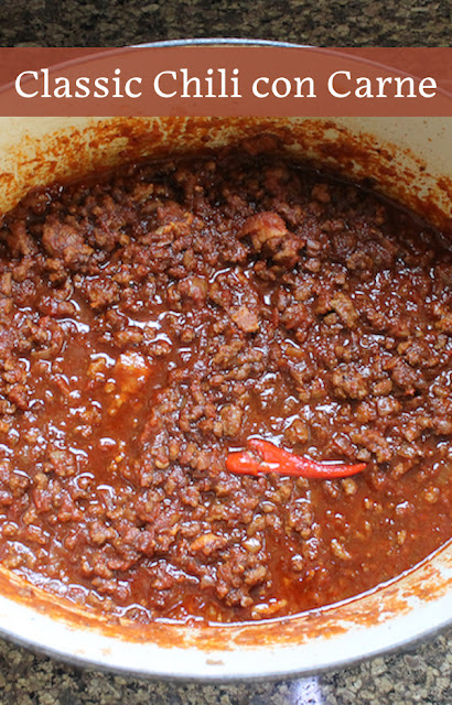 Food Lust People Love: This Classic Chili con Carne is made with ground beef, smoked bacon and tomatoes, and flavored with onion, chili powder, cumin and chili peppers. It's a warming bowl of comfort.