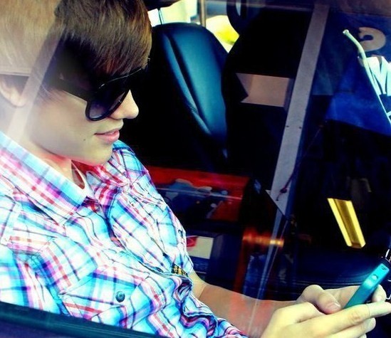 justin bieber with glasses on 2011. justin bieber purple glasses