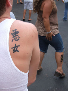 kanji fails: the kanji for 'bad woman' tattooed on a man's shoulder