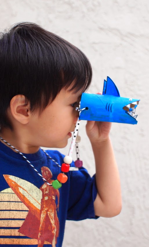 Make a pair of shark binoculars with the kids!  Fun way to reuse toilet paper rolls!