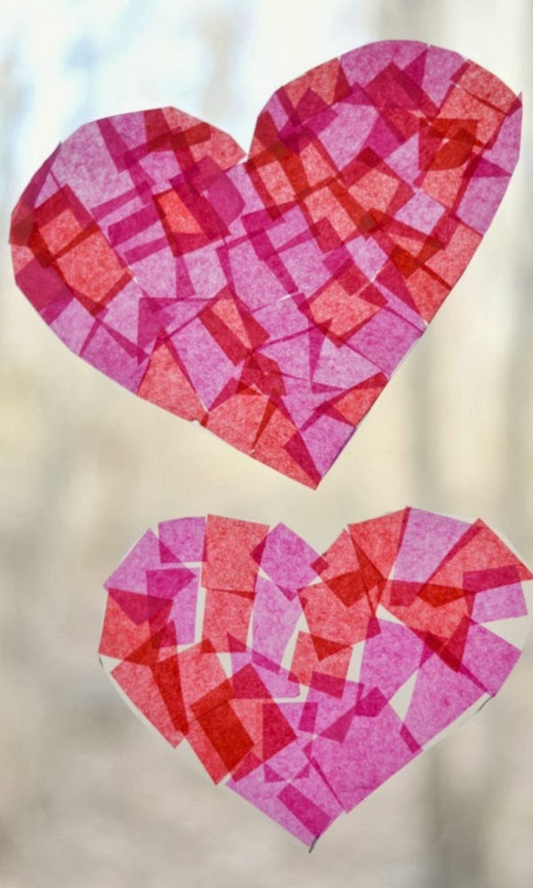 Keeps kids busy while strengthening fine-motor skills with this heart collage craft for kids! #heartcrafts #valentinesday #craftsforkids #suncatchersforkids #growingajeweledrose #craftsforvalentinesday