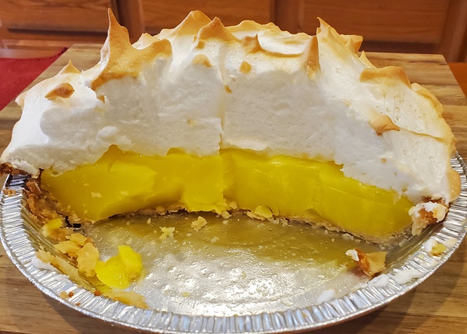 cut open lemon meringue pie piled high