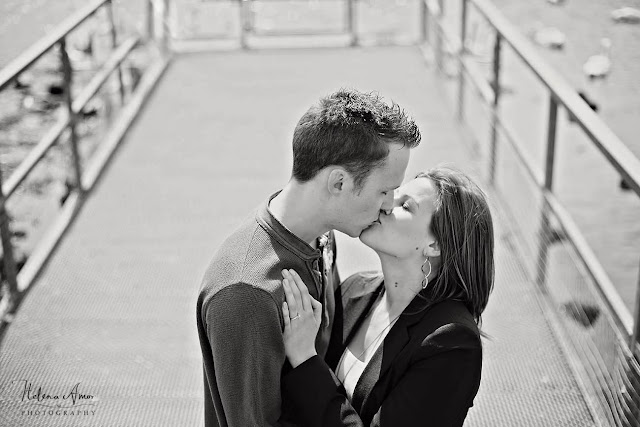 engaged couple kissing