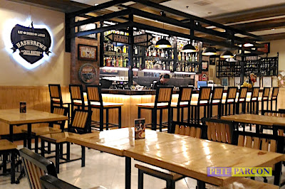 Interior of Hashbrews Café Bistro with tables, chairs, and bar area