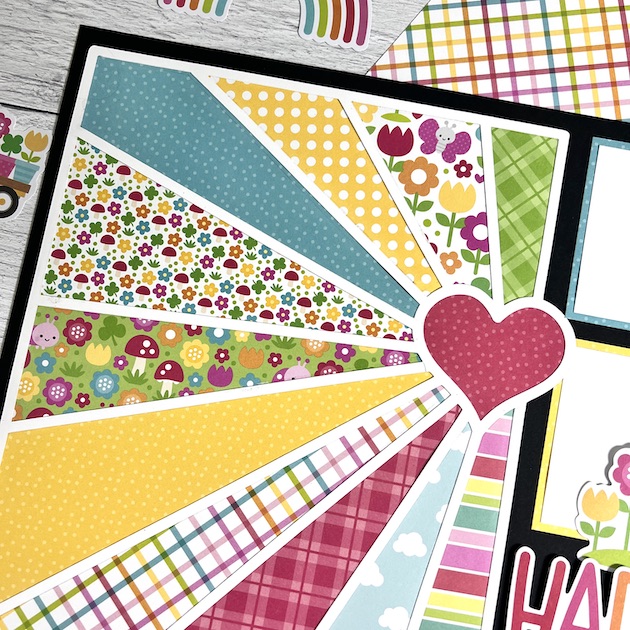 12x12 Heart Burst Scrapbook Layout with flowers, mushrooms, ladybugs, and clovers