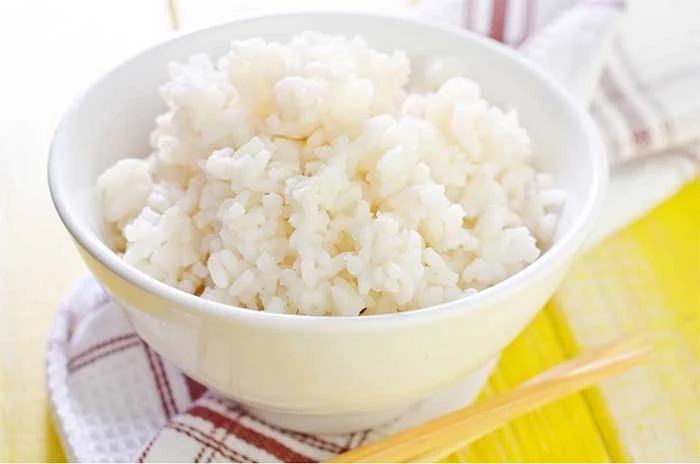 How to cook perfect rice in the Instant Pot pressure cooker.  Learn about the best ratio of rice to water and cooking time for the best sticky, fluffy white rice.  Cook white long grain rice for meals or side dishes with this guide.  Using the Instant Pot makes cooking rice so easy!  #rice #instantpot 